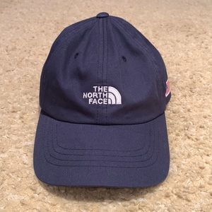 The North Face hat with American flag on the side.